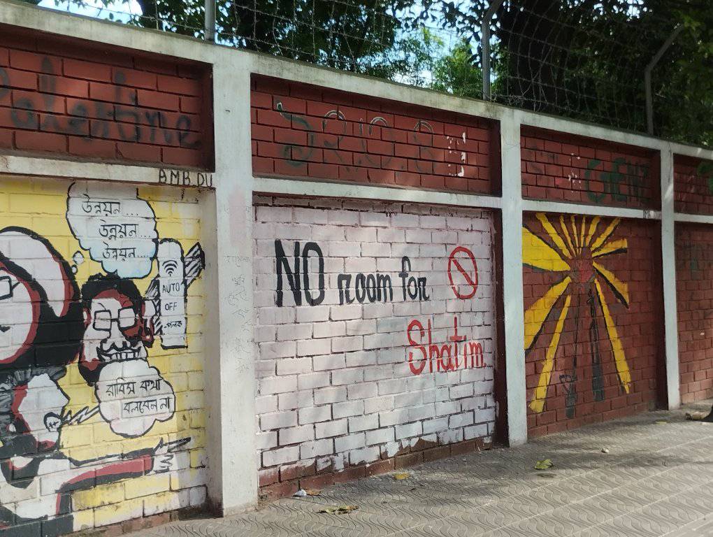 Graffiti on the walls of Dhaka University - Bangladesh’s largest and most prominent institution - calling for the elimination of "Shatims," meaning those who criticize the Prophet Muhammad